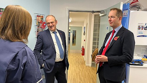 Richard Foord and Ed Davey speaking to a nurse