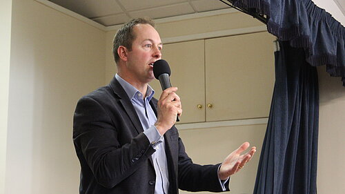 Richard Foord MP speaking at a public meeting in support of Seaton Community Hospital in Colyford Memorial Hall